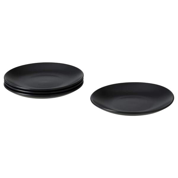 Image shows four black FÄRGKLAR ceramic plates, three stacked and one single, with a simple, round design.