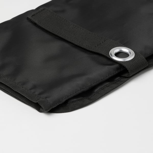Black cable organiser with sturdy, recycled polyester material and strong metal eyelet. Hangs neatly.