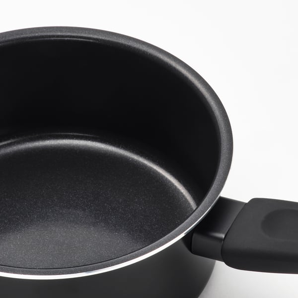 Black saucepan with non-stick coating and ergonomic handle, perfect for cooking and easy to clean.