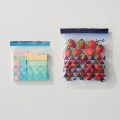 Two resealable bags displayed: left with colourful paper, right with strawberries, brand IKEA.