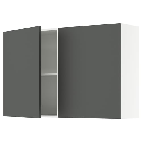 Wall-mounted cabinet, single door open, reveals adjustable shelf.