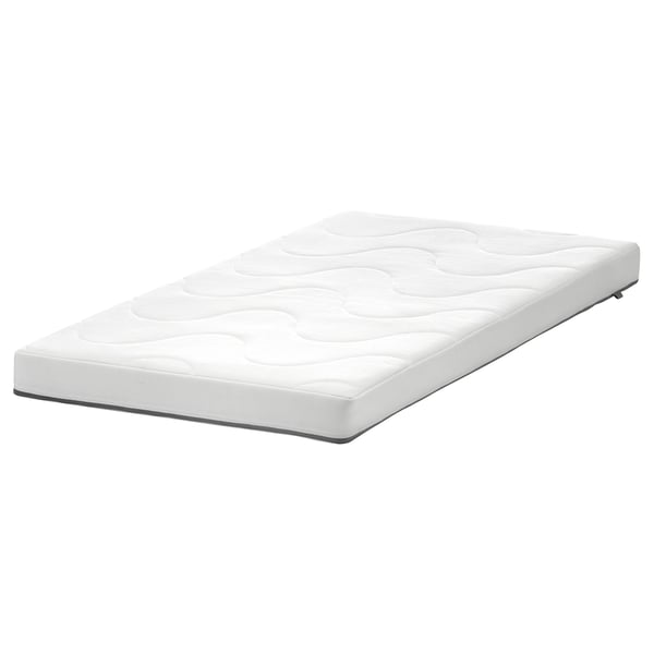White KRUMMELUR cot mattress, rectangular, quilted surface, polyester, safe for kids.
