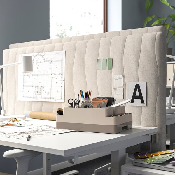 Modern office with KUGGIS organiser near window and blueprints.