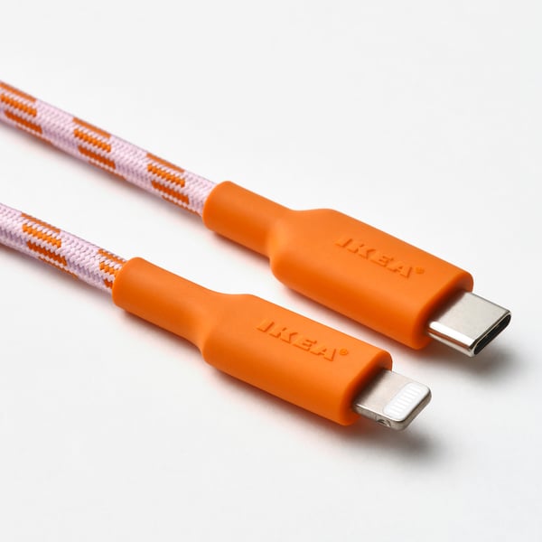 Two ikea usb cables: lightning and usb-c with braided design and elastic band.