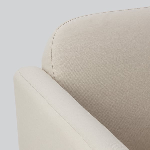 Close-up of a plush, beige sectional sofa with smooth, clean lines and durable fabric.