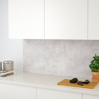 White kitchen counter with avocados. Modern design, functional and easy-to-clean.