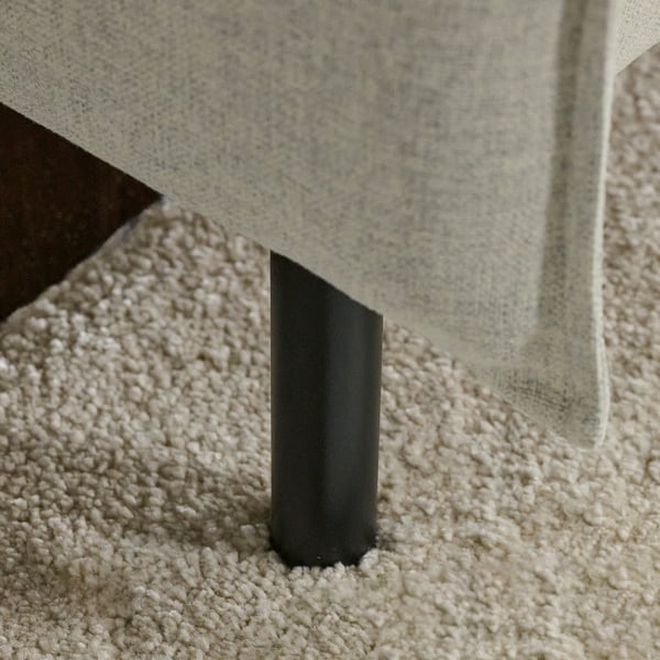 Angle shot of minimalist sofa leg, sleek design, modern aesthetic.