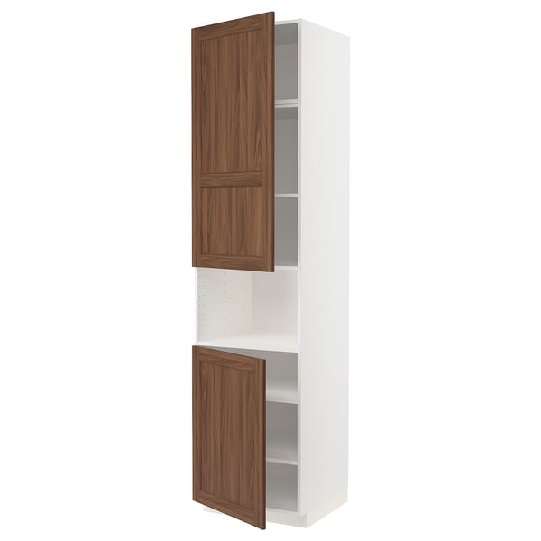 A white METOD kitchen cabinet with walnut-colored wooden doors. It two doors, three shelves, and a modern design.