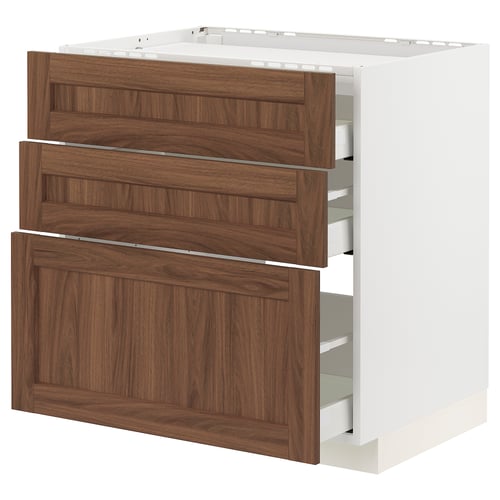 METOD kitchen cabinet in white with walnut drawers. Three pull-out drawers with wooden texture, set against white frame.