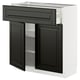 Modern kitchen cabinet with dark grey doors and drawer, white frame, and adjustable shelves.