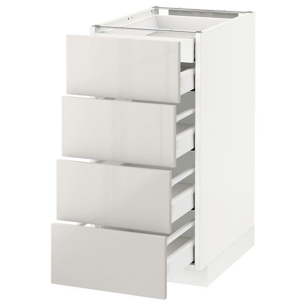 White METOD kitchen unit with four grey high-gloss drawers, sleek and modern design.