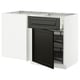 Modern kitchen unit with black bevelled doors and a white top, featuring a pull-out shelf.