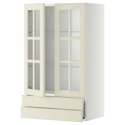 An off-white METOD kitchen cabinet with glass doors, featuring a classic design with bevelled edges and adjustable shelves.