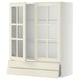 Off-white kitchen cabinet with glass doors, metal drawers, and wooden frame, traditional design.