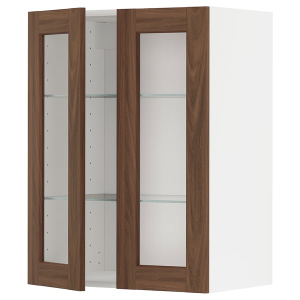 Modern kitchen cabinet with walnut doors and glass shelves.