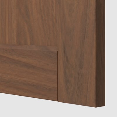 Close-up of a walnut-finished wooden cabinet door, showcasing its smooth texture and sturdy construction.