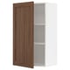 A white METOD kitchen wall cabinet with a single wooden door in walnut finish. It has one adjustable shelf inside and the door is slightly open.