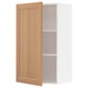 Wooden METOD wall cabinet in oak with white interior and adjustable shelf.
