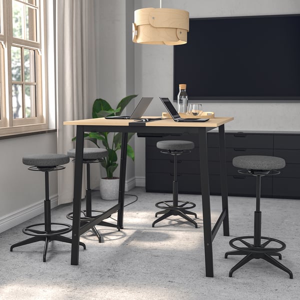 MITTZON conference table with black legs, light wood top, four stools, pendant lamp, spacious & functional.