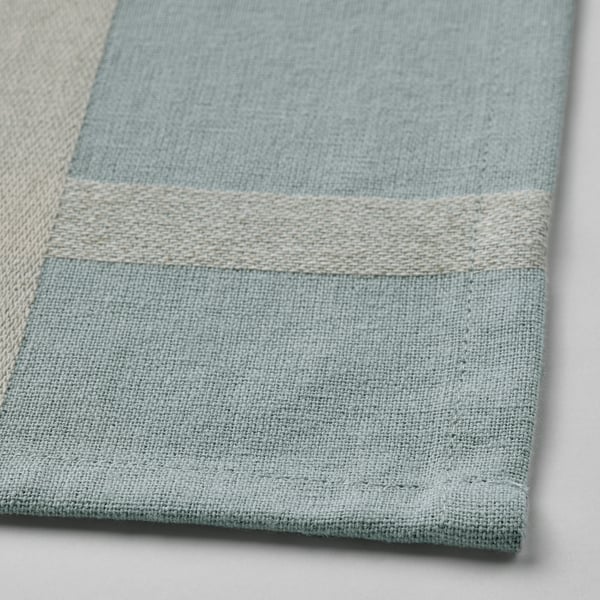 Close-up of a NISSÖGA tablecloth, showcasing its woven cotton and jute texture, highlighting its durable and natural design.