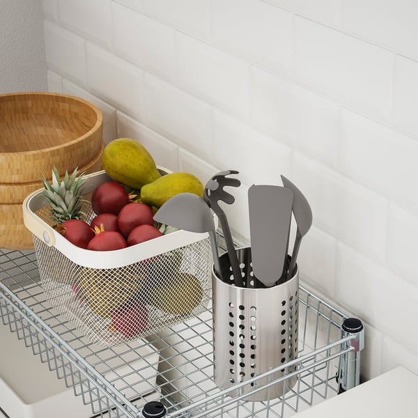 Mesh OLAUS storage basket holds fruits and utensils; adjusts, easy setup.