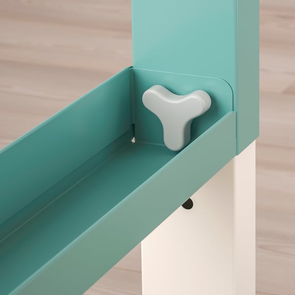Adjustable turquoise desk with sleek design and knobs for height adjustment.