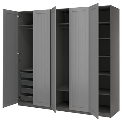Grey PAX wardrobe with open doors, featuring shelves and drawers, made of particleboard and fiberboard.