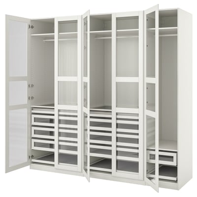An open white ikea PAX wardrobe with multiple drawers and shelves for storage.