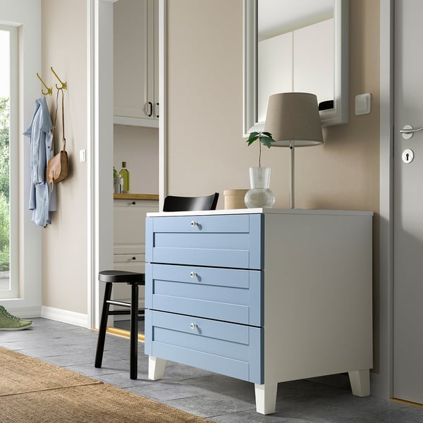 Modern grey blue PLATSA drawer set with lamp and mirror in clean, minimalist room.