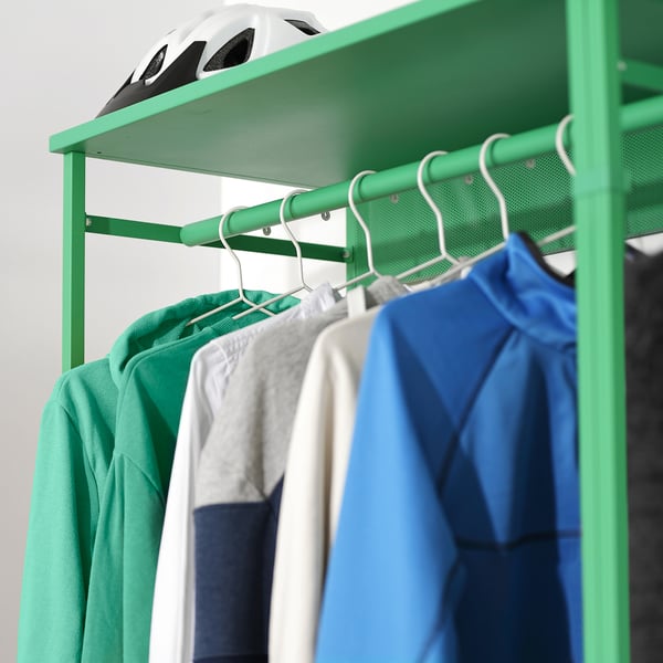 Green PLATSA wardrobe with clothes and helmet.