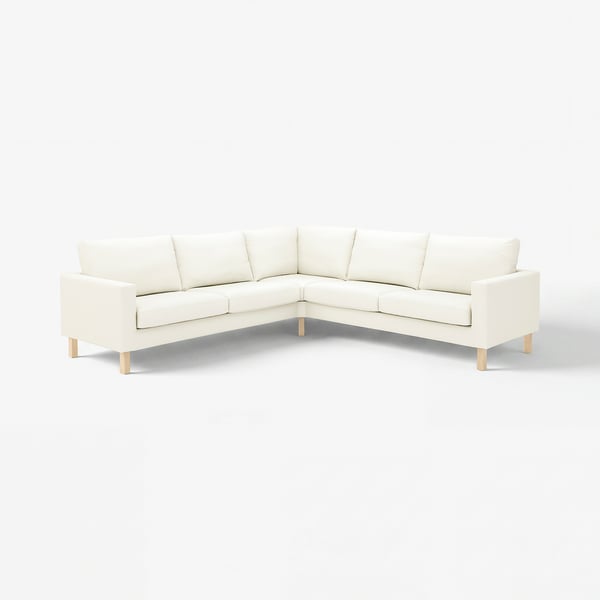 A white l-shaped sofa named SALTSJÖBADEN, featuring light cotton fabric with slight texture, recycled polyester back, clean lines, and wooden legs.