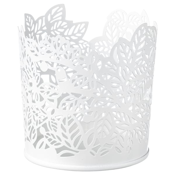 White SAMVERKA tealight holder with leafy design, candle shadows.