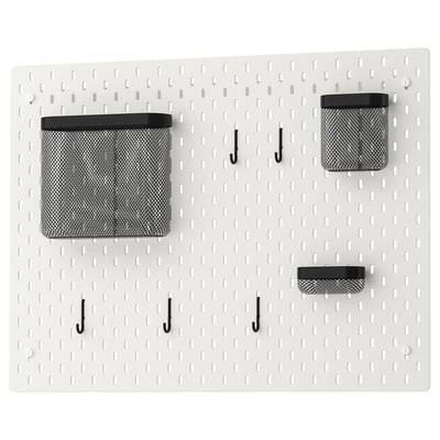 SKÅDIS white pegboard with black mesh bins and hooks for wall organisation.