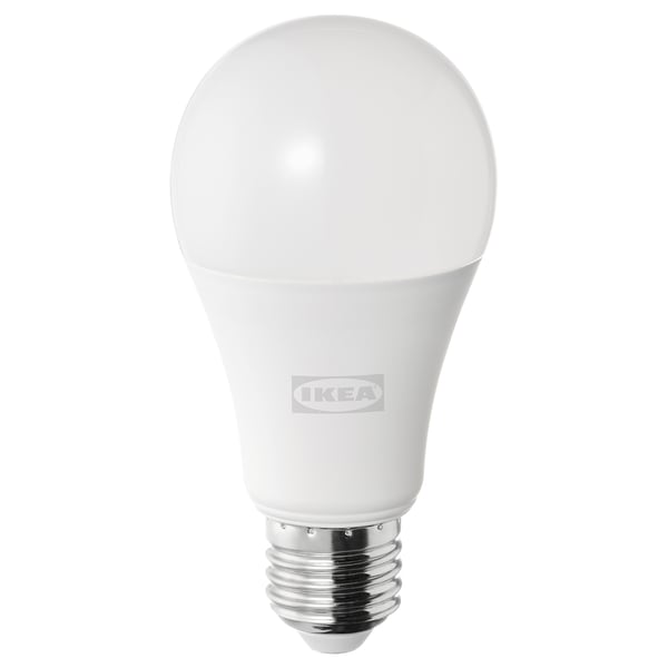 An ikea led light bulb, white, round shape, with a metallic base.