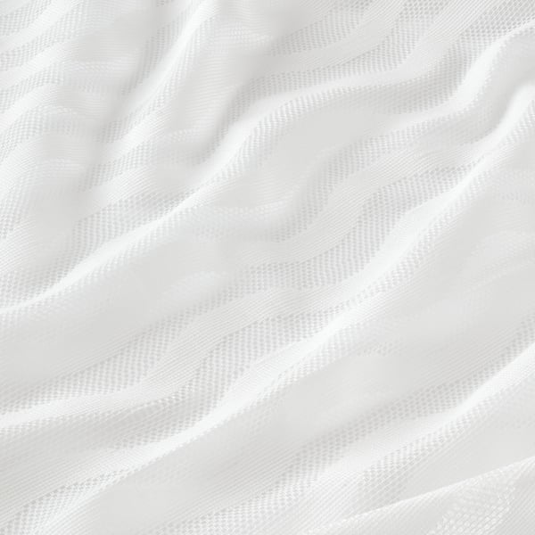 Elegant white curtains with subtle wave pattern, sheer for soft light and privacy.