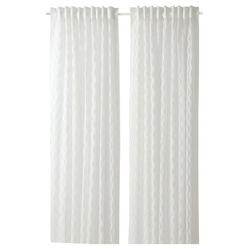 Two sheer white curtains hang side by side with a subtle wave pattern. They are made of 100% recycled polyester.