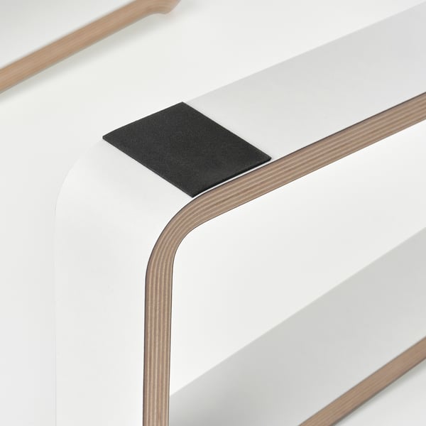 Modern laptop stand with sleek, layered wood design, featuring non-slip pads for stability and airflow.