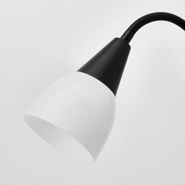 A sleek black desk lamp with a white shade and flexible neck. Modern and durable, perfect for reading or general use.