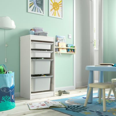 TROFAST kids storage unit with boxes, next to blue table/chairs, book, blue rug - toy storage.