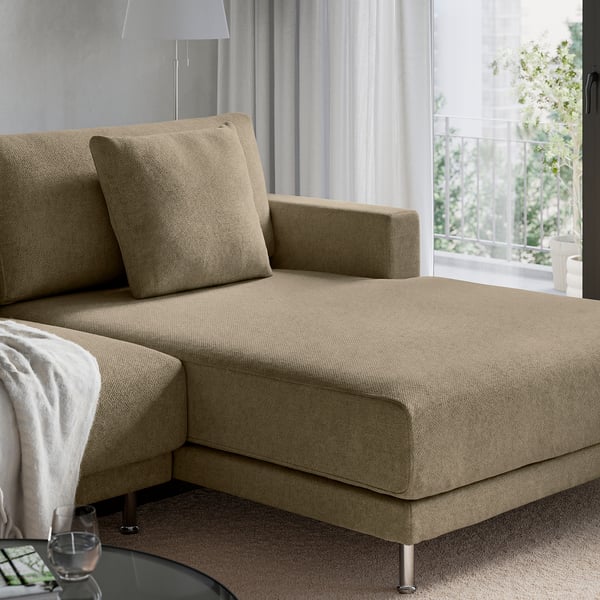 Modern beige sectional sofa with sleek design, plush cushions, and metal legs in a stylish living room.