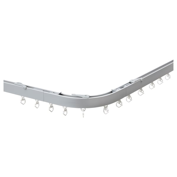Silver VIDGA curved curtain rail with hooks for corner windows.