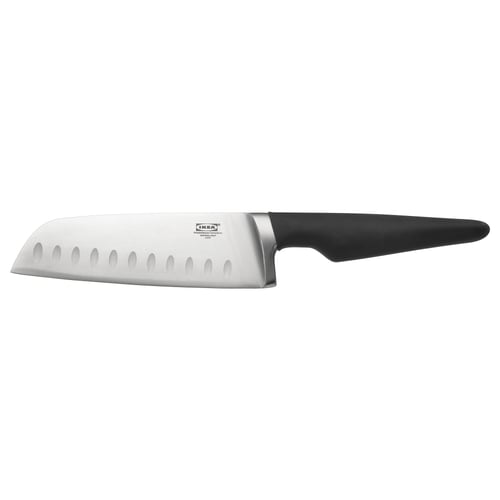 A VÖRDA vegetable knife with a black handle and silver blade, designed with indentations for easy slicing.
