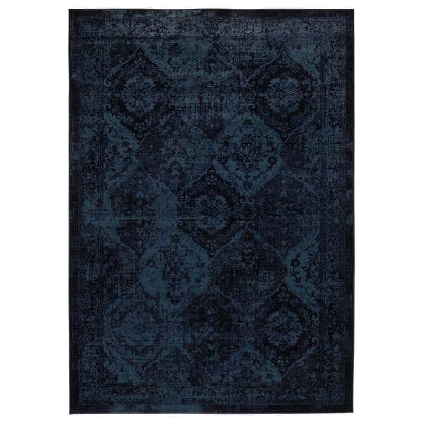 The VONSBÄK rug is a deep blue with intricate patterns, rectangular and low pile, made from polypropylene.