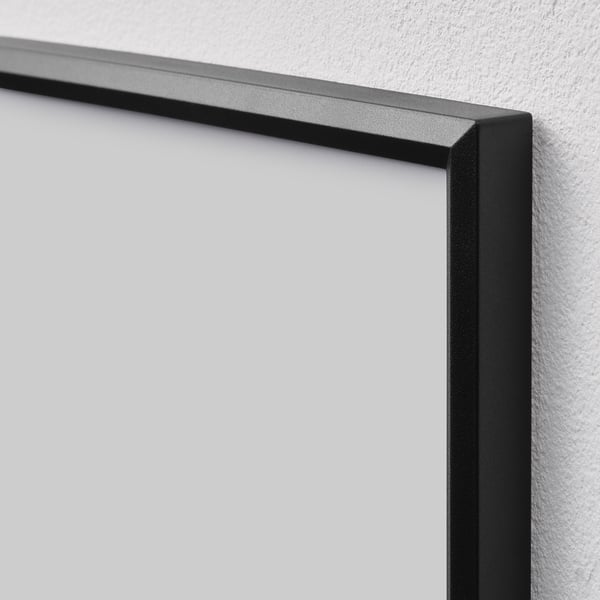 Black picture frame corner, sleek plastic design, sturdy and modern, hangs or stands.