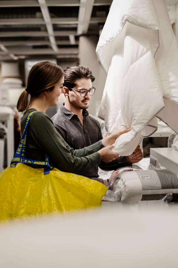 Woman and man looking at IKEA products at a store.