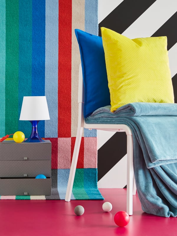 A blue LAMPAN table lamp in the living room