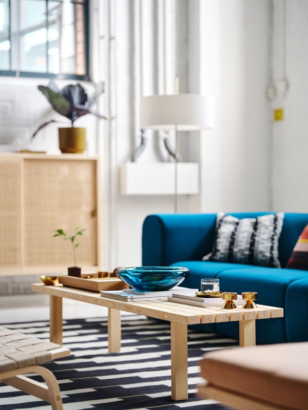 A dark blue-turquoise STOCKHOLM 2025 bowl in the living room
