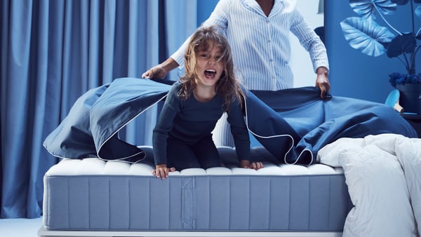 A firm/light blue VALEVÅG pocket sprung mattress