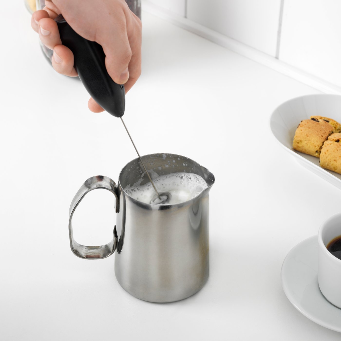 A black PRODUKT milk-frother