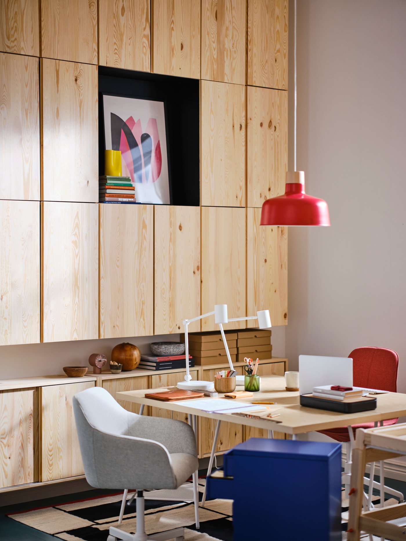 Wall of light pine storage cabinets in an modern office setting